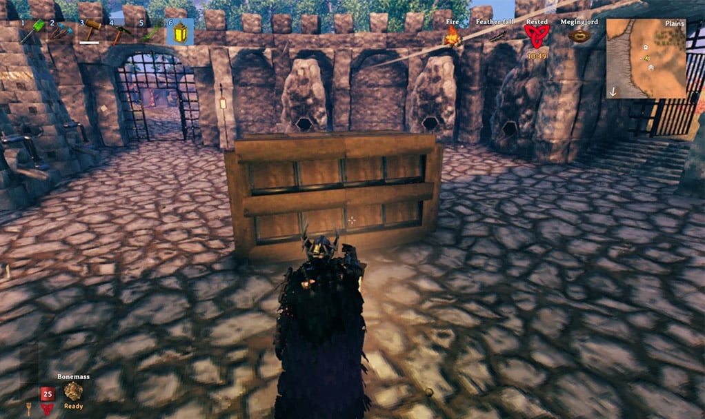 Compact vertical stacked chest storage using small wooden floor shelves in Valheim
